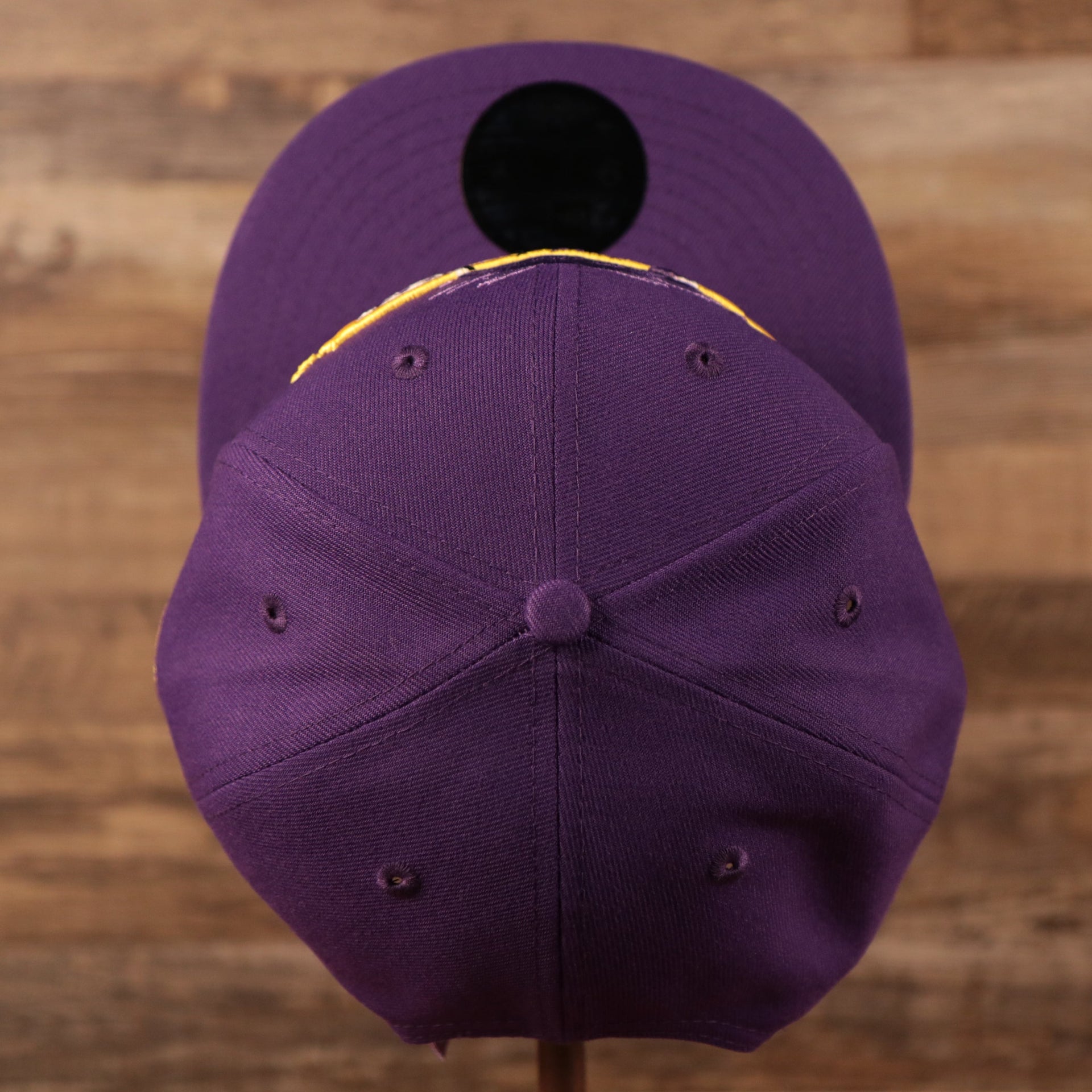 A top view of the crown of the logo tear Los Angeles Lakers purple 9fifty snapback hat.