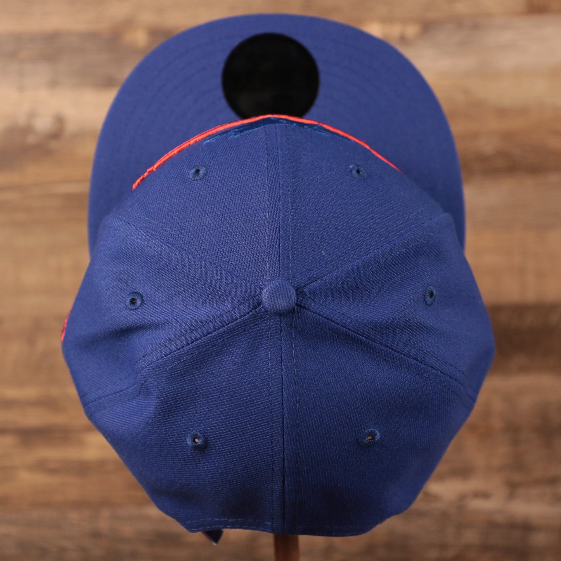 A top view of the crown of the youth royal blue Philadelphia 76ers 9fifty snapback hat.
