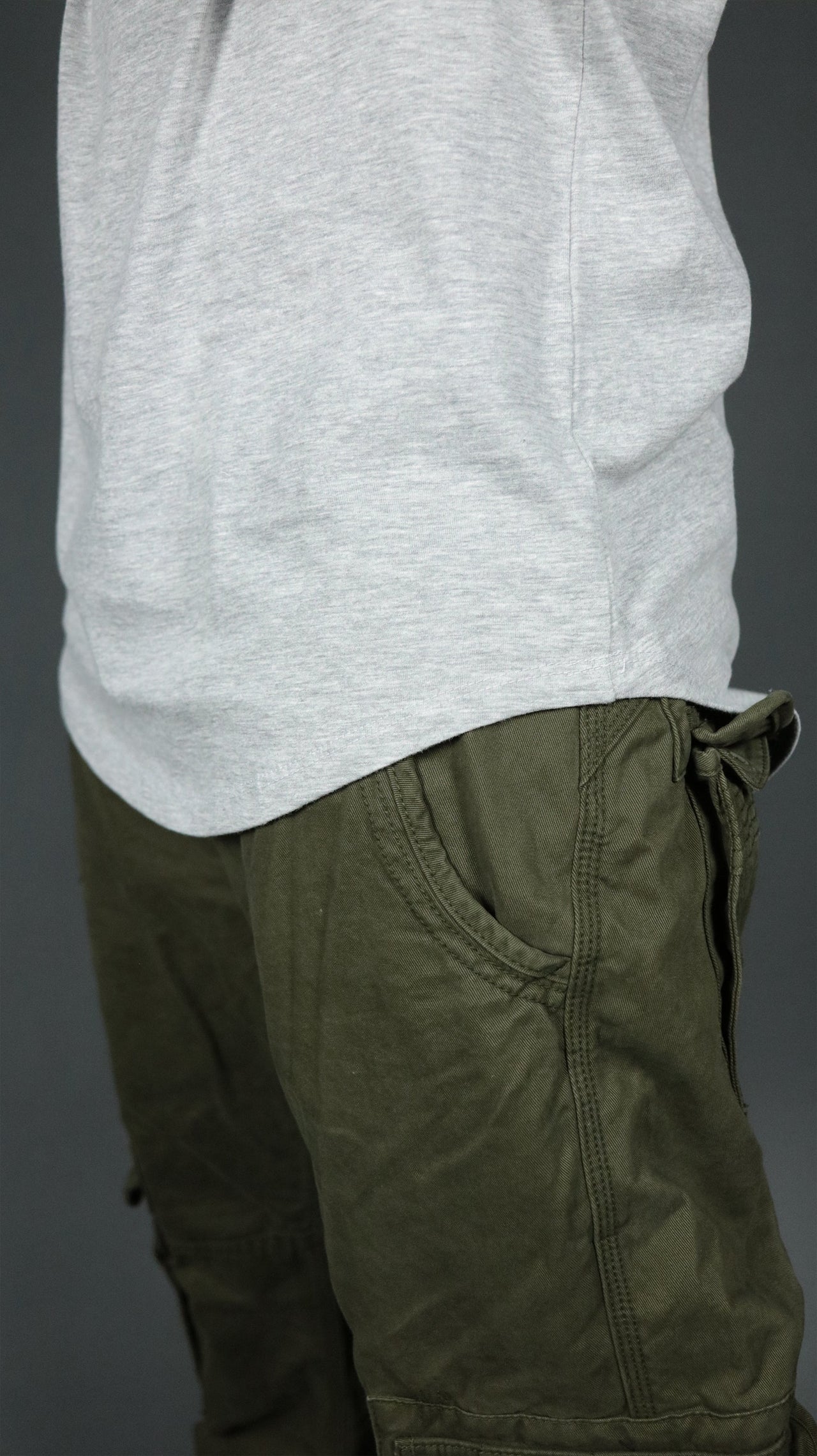 The longline hem drop cut design of the grey Jordan Craig longline shirt.