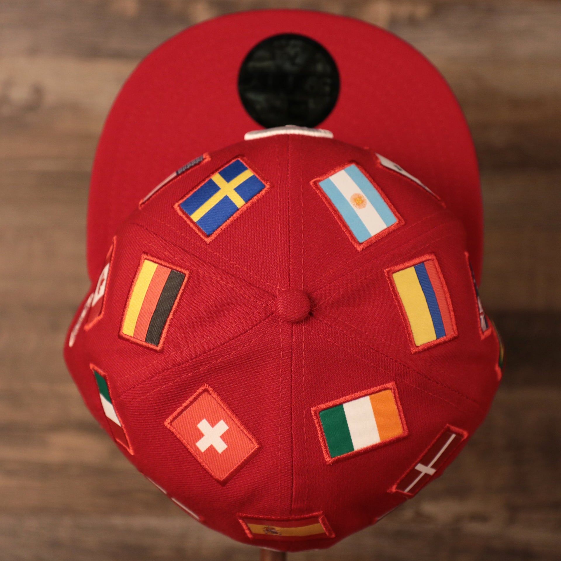 from the top view of this cap, you can see the flags from Germany, Ireland, and Argentina Phillies World Flags Gray Bottom Fitted Cap | Philadelphia Phillies International Flags Red Grey Under Brim Fitted Cap