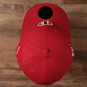 A top side view of the crown of the Philadelphia Phillies red MLB on field fourth of July 3930 flexfit cap by New Era.