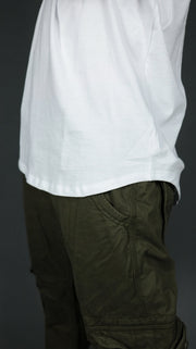 White longline Jordan Craig shirt with hem drop cut scoop bottom design.