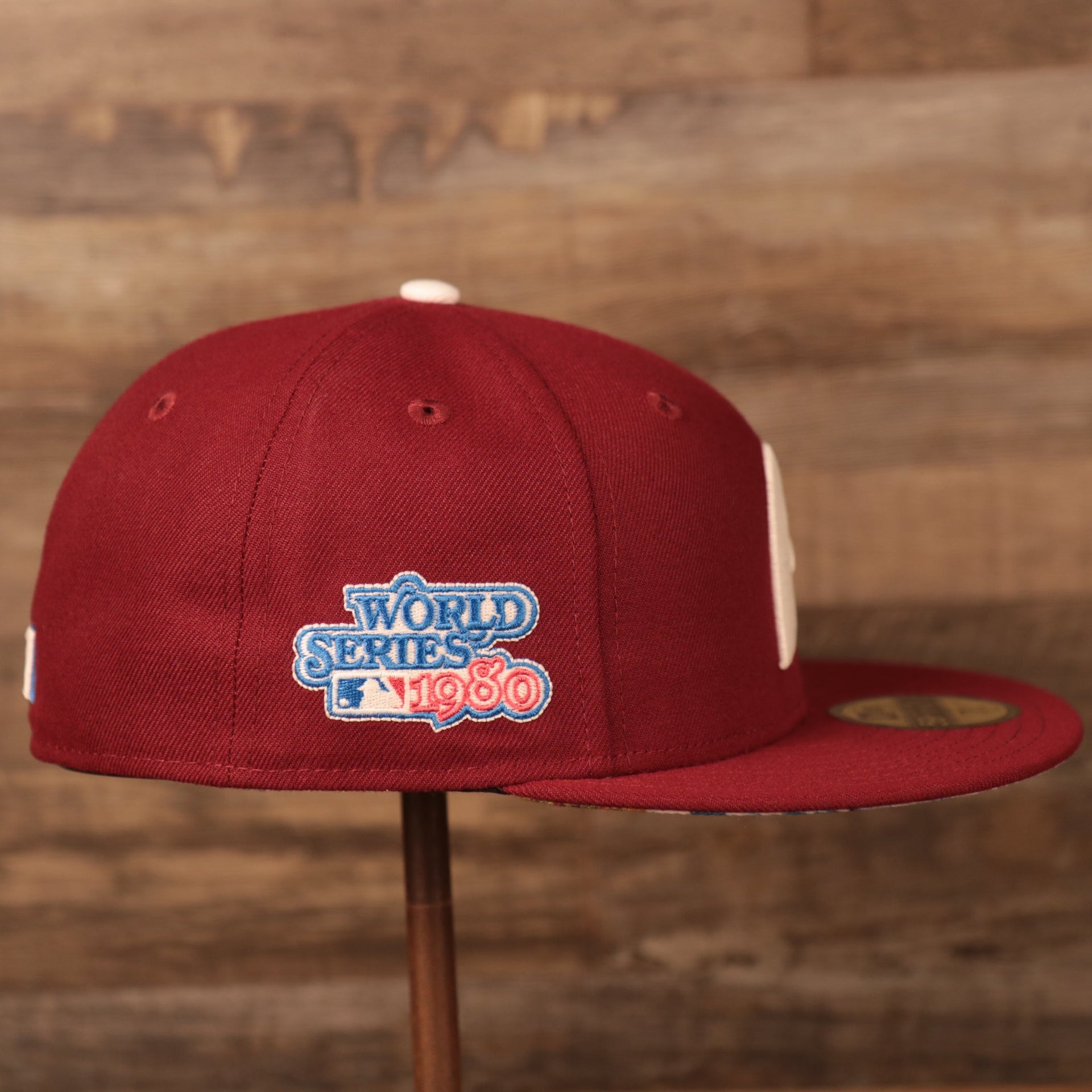 The right side of the retro maroon Philadelphia Phillies white flower bottom brim 59fifty hat has the patch for the 1980 World Series.