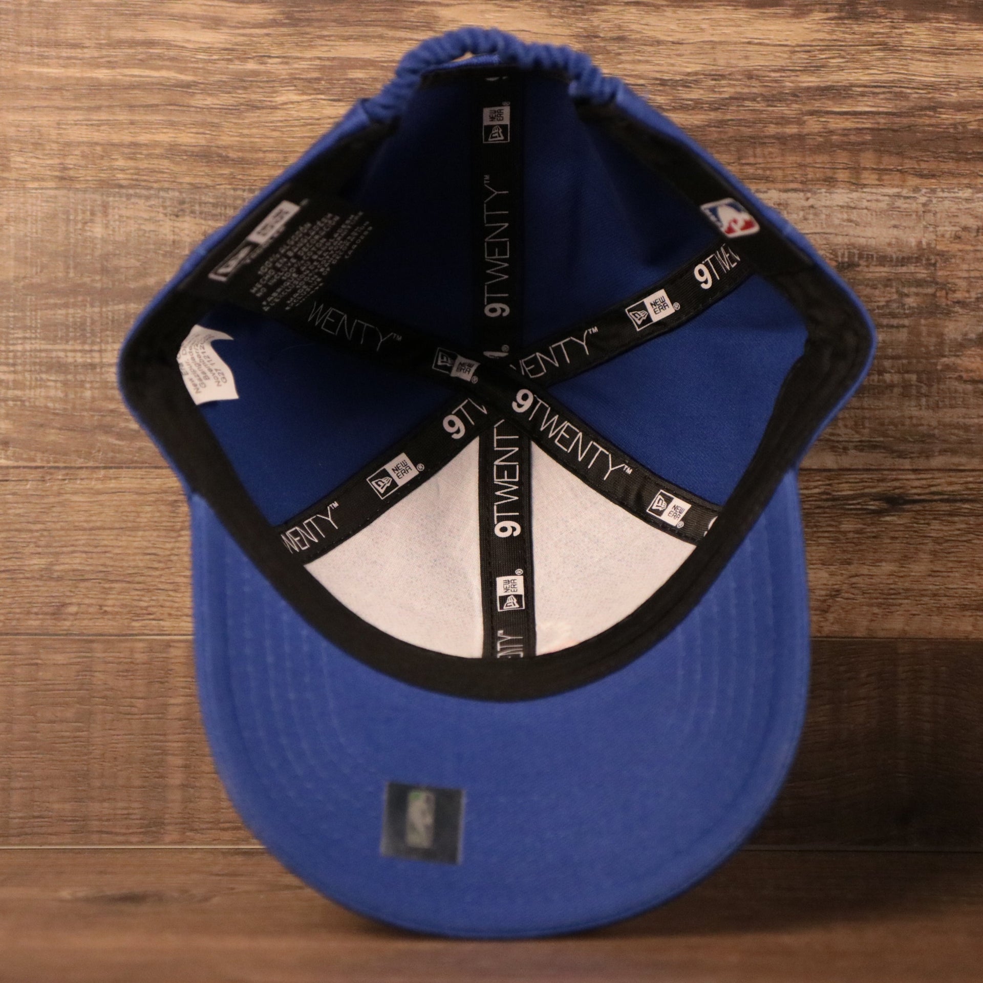 An inside look of the royal blue sixers infant 9twenty dad hat.