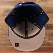 An inside view of the youth Philadelphia 76ers gray brim logo tear royal blue 950 snapback hat by New Era.