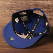 An inside view of the crown of the royal blue toddler baseball cap for the Philadelphia 76ers.