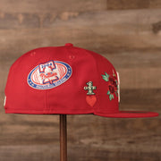 The Phillies inaugral season patch on the right side of the red all over patch fitted hat by New Era.
