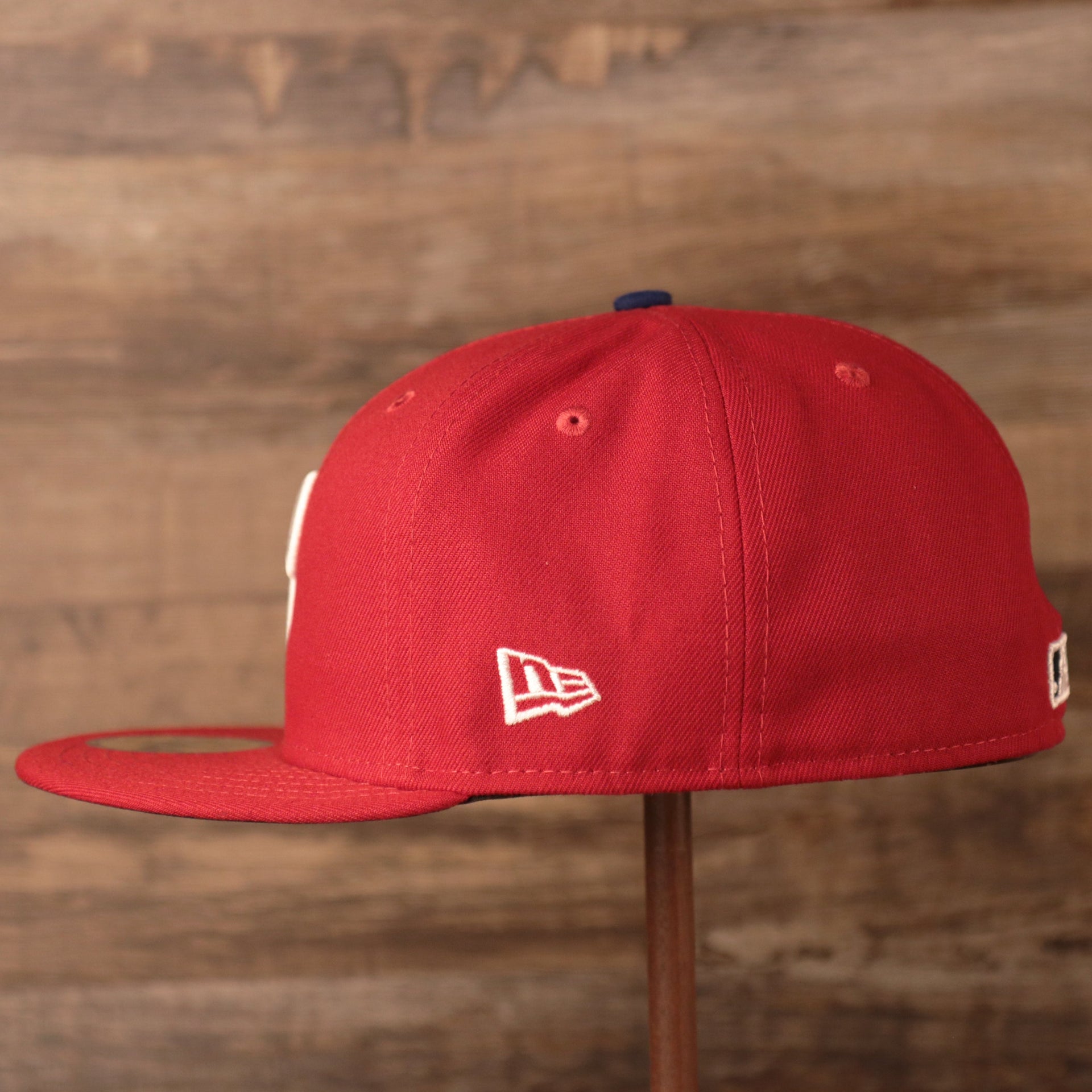 The wearers left side has the new era logo Phillies Jackie Robinson Fitted Cap | Philadelphia Phillies On-Field Jackie Robinson Side PatchRed Fitted Hat
