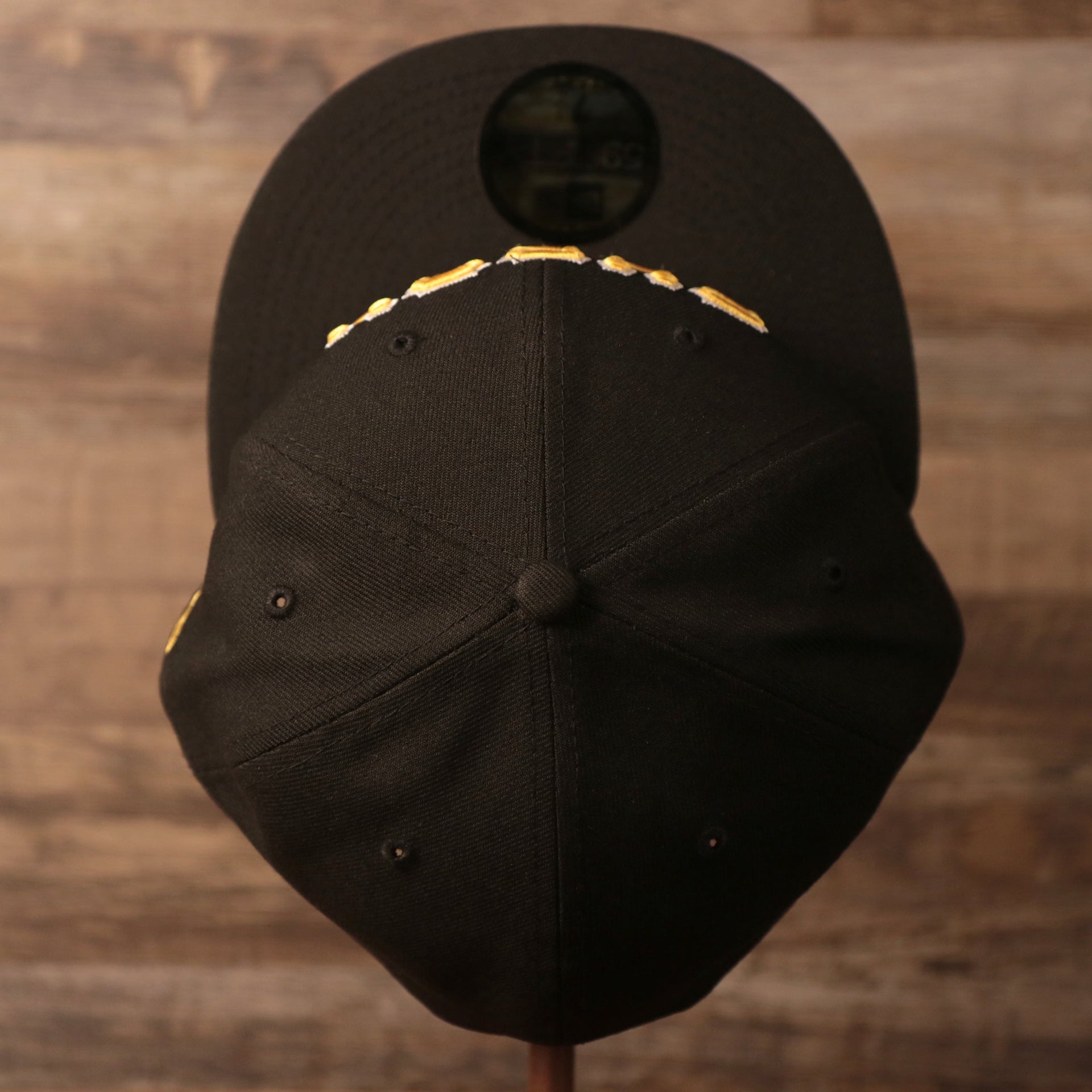 The Pittsburgh Pirates black all over patch fitted 59fifty hat's crown from the top.