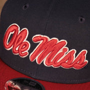 ole miss logo off the Ole Miss Rebels Navy Adjustable 9Fifty Orange Brim Snapback Cap