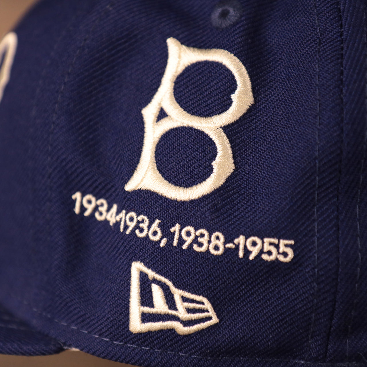 The 1934 and 1955 logo of the Dodgers on the blue New Era 59fifty.