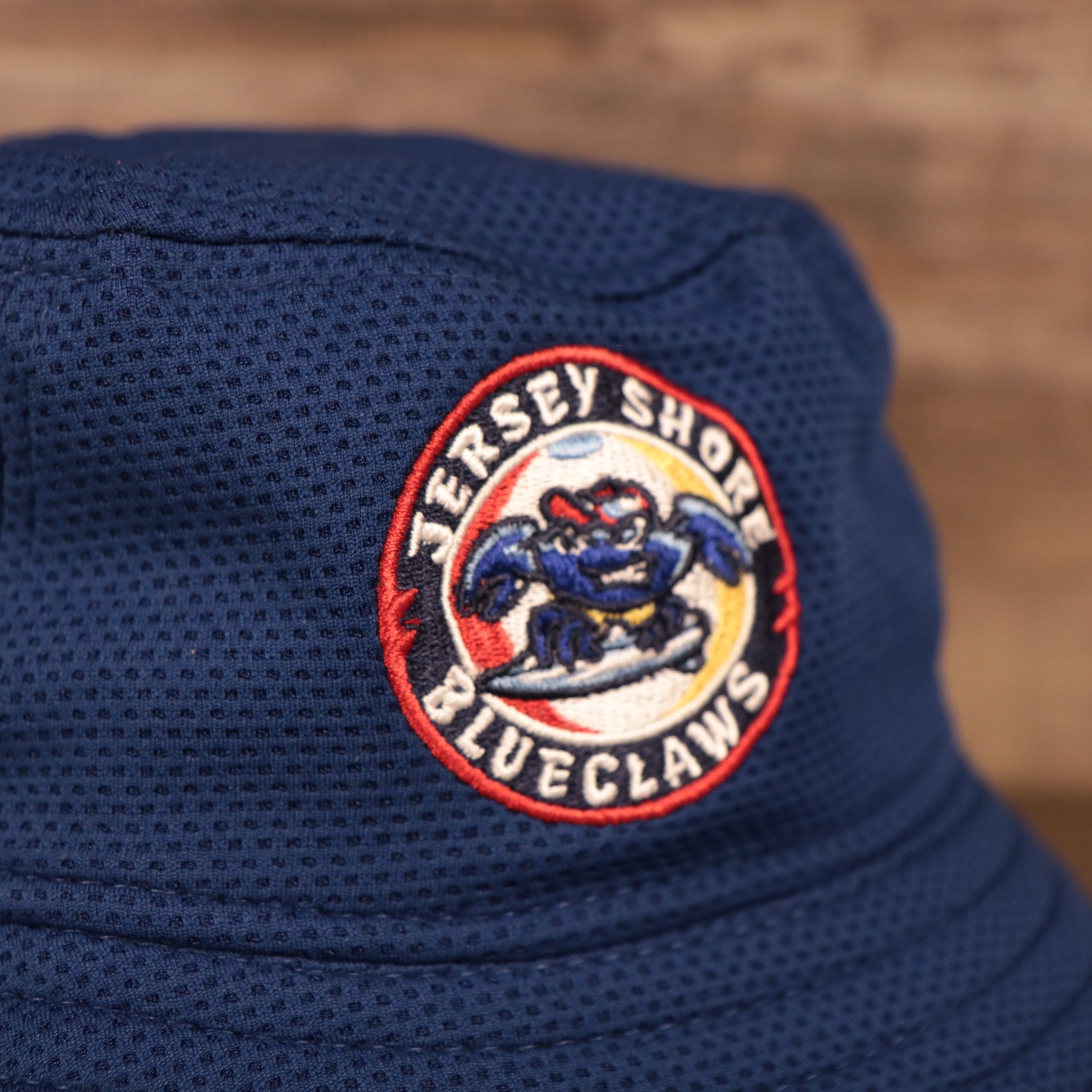 A close up shot of the front logo , for the Jersey Shore BlueClaws bucket hat