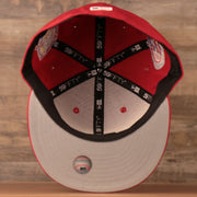 The grey underbrim of this red all over patch New Era fitted hat for the Philadelphia Phillies