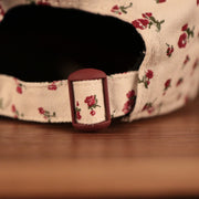 The backside of the Phillies hat with flowers has an adjustable strap.