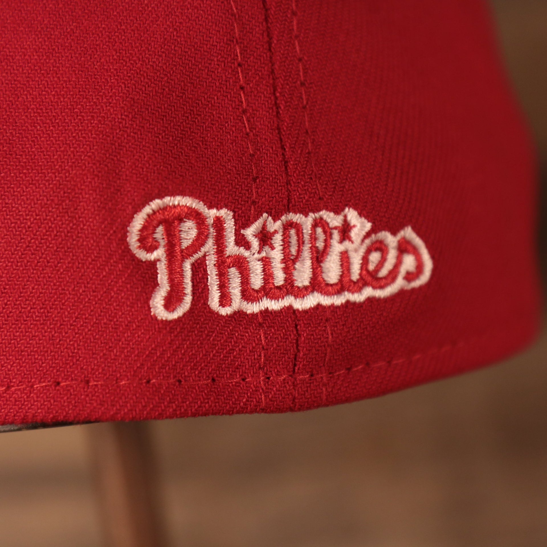 A closeup shot of the Phillies patch on the backside of the Fightin Phils 2021 fourth of July red 39thirty flexfit hat.