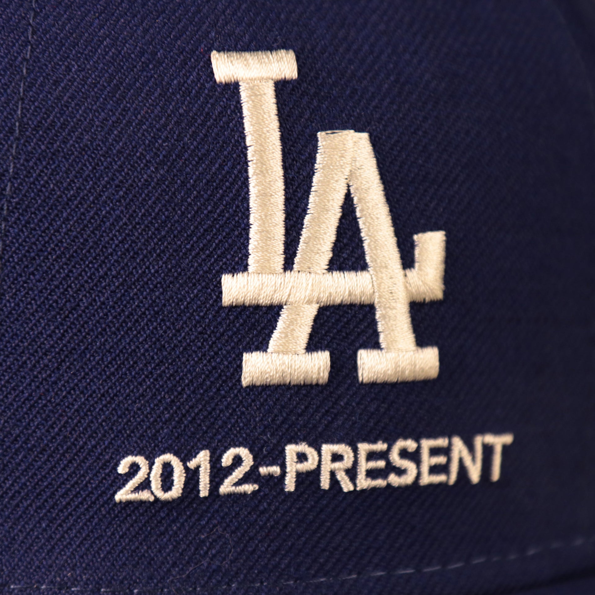 The current Dodgers logo used from 2012 to present on the navy logo history all-over patch fitted 59fifty.