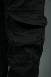 One of the six pockets of the black cargo pants for men.