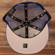 An inside look of the gray bottom brim mesh snapback hat for the Philadelphia 76ers.