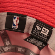 The inside NBA and New Era OSM patch on the inside of the red Houston Rockets boonie hat.