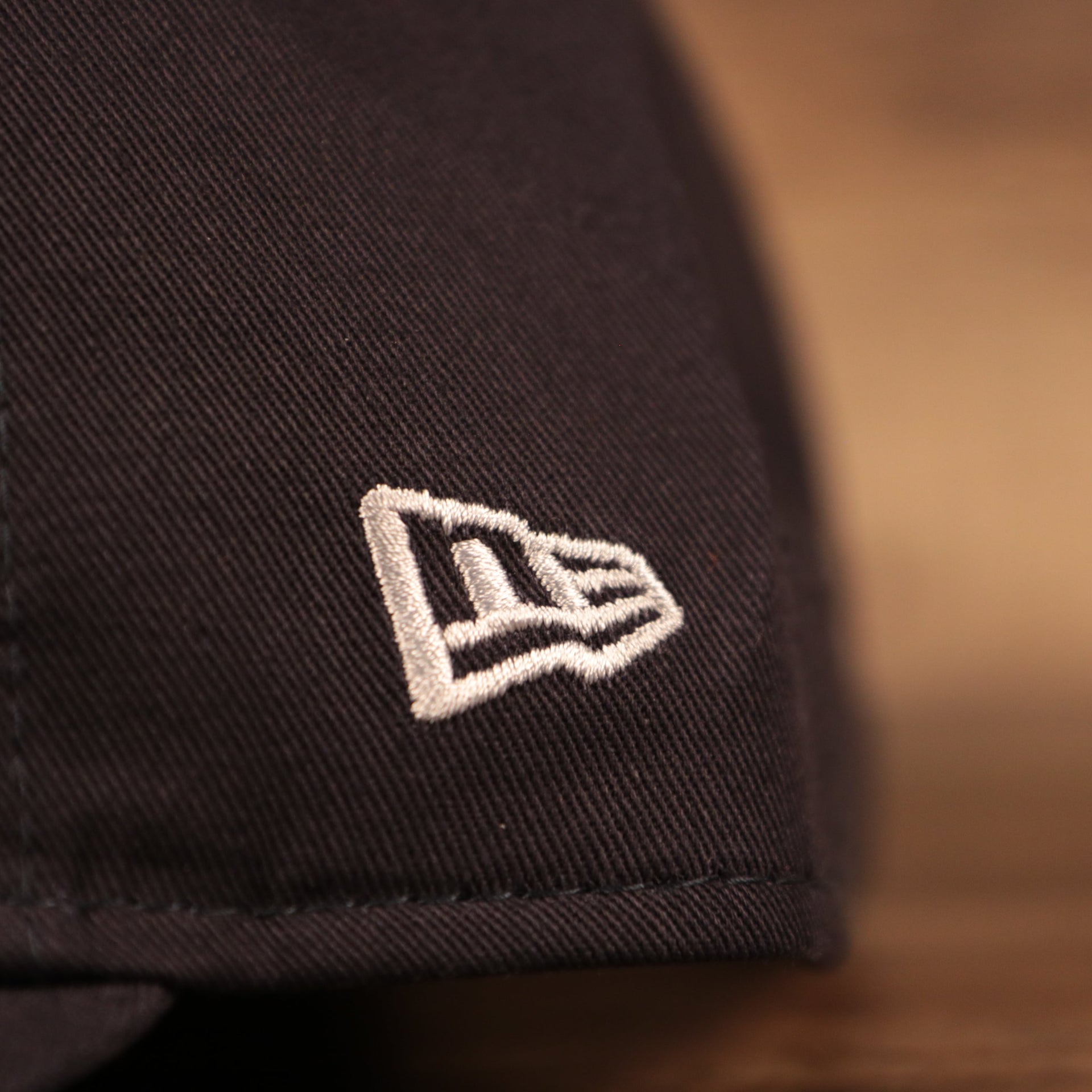 The white New Era logo patch on the left side of the Yankees toddler 9fifty dad hat.