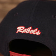 rebels logo on the back of the Ole Miss Rebels Navy Adjustable 9Fifty Orange Brim Snapback Cap