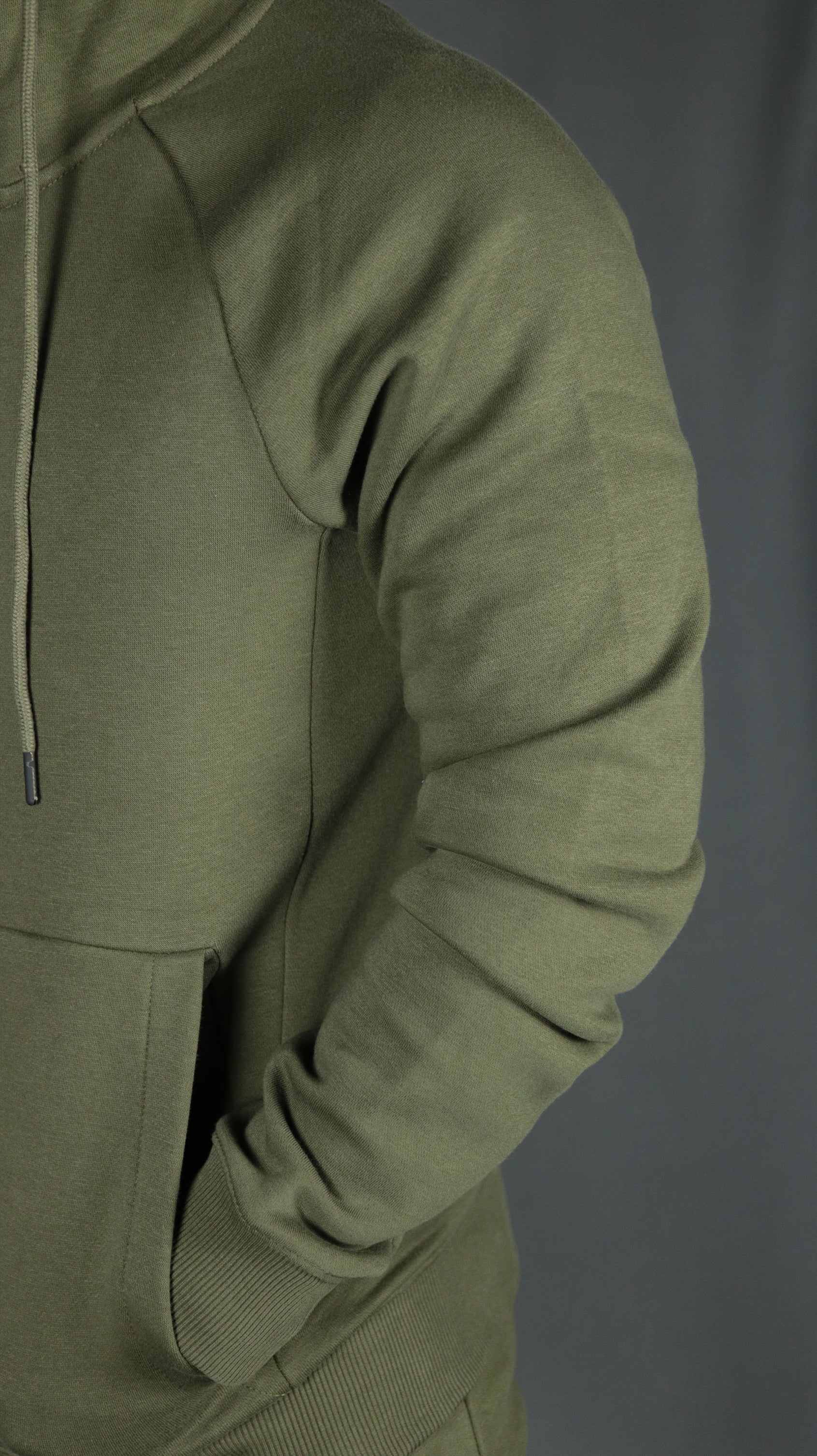 The military olive green basic fleece hoodie has two spacious pockets.