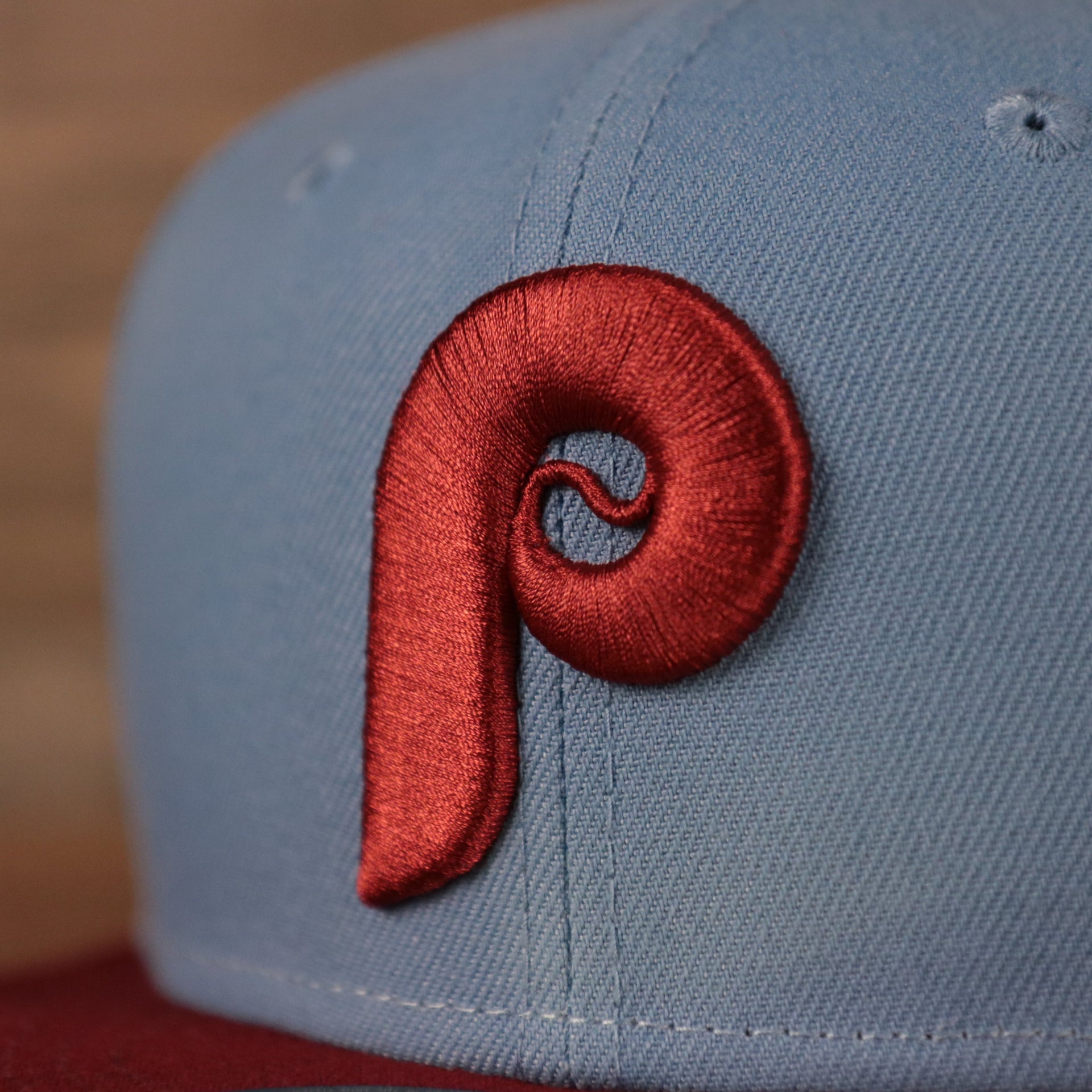 The cooperstown Phillies logo in maroon on the front of the ice/blue maroon 1980 World Series Philadelphia Phillies side patch New Era fitted hat.