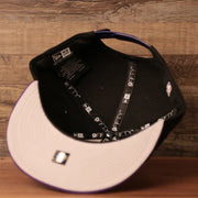 The Lakers black/purple 9fifty, the inside of the Los Angeles Lakers champions 2020 snapback hat with gray brim by New Era snapback hat with grey bottom.