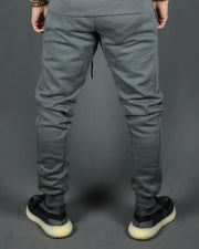 The back side of the Jordan Craig charcoal jogger pants with logo trim bottom.