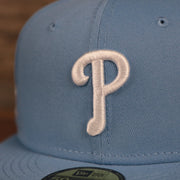 The white Philadelphia Phillies logo on the front side of the MLB 1996 All Star Game ice blue side patch New Era fitted cap.