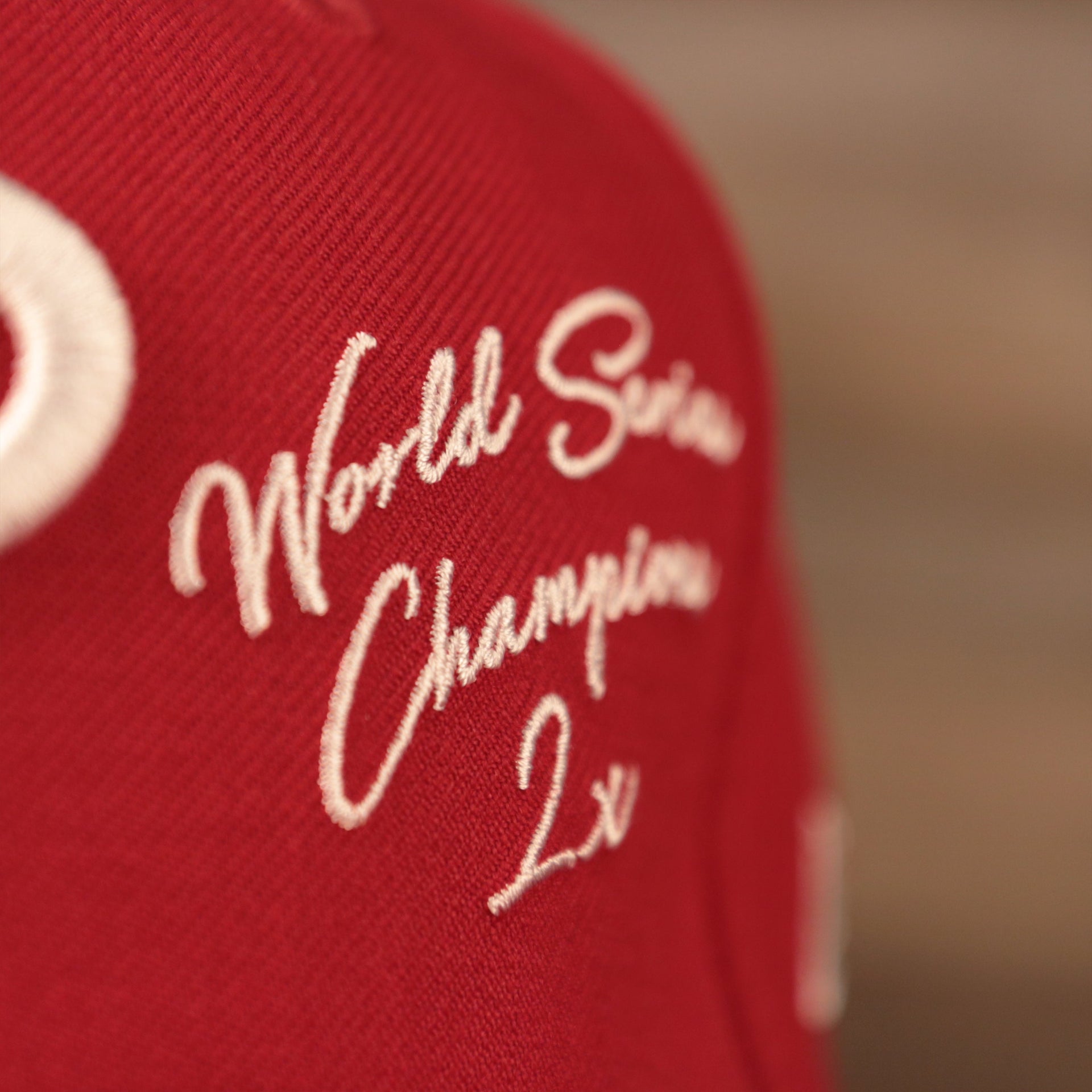 The World Series Champions 2X patch on the front side of the red all over embroidered Phillies 59fifty.