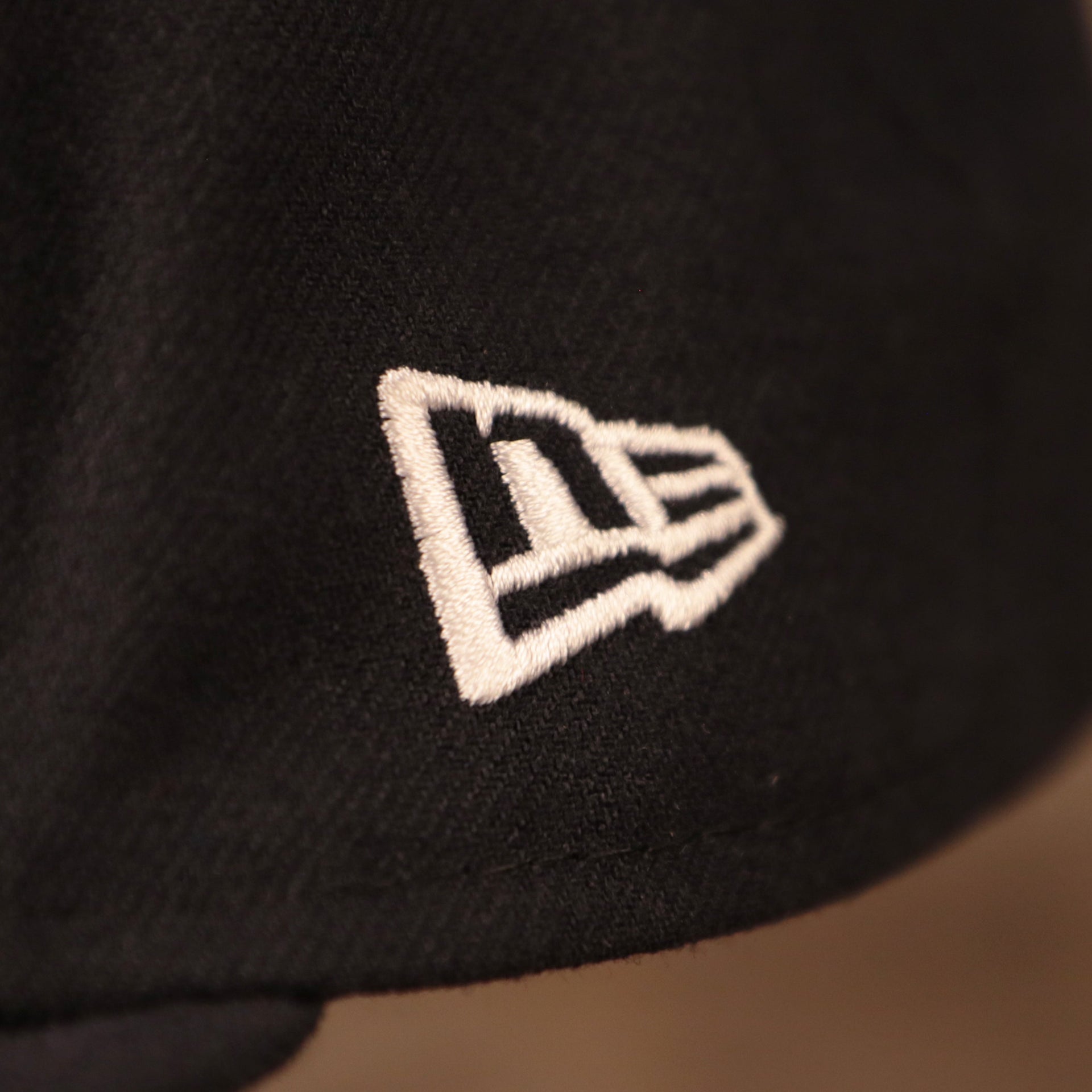 New Era Logo shown up close on this Black Bottom 59Fifty