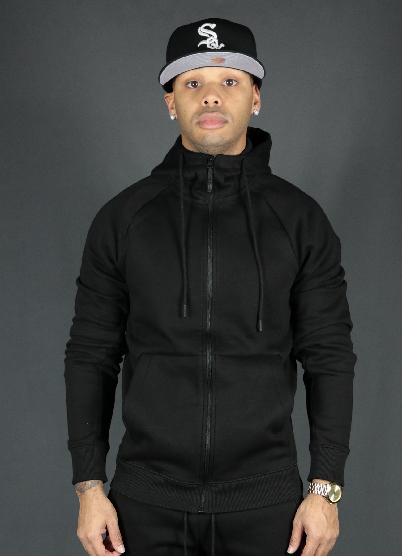The black basic tech fleece zipup hoodie by Jordan Craig.