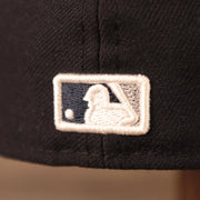Up close view of the Major League Baseball logo on this 59Fifty Black Bottom Cap