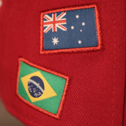 the two flags in this picture are from the countries of Brazil and Australia Phillies World Flags Gray Bottom Fitted Cap | Philadelphia Phillies International Flags Red Grey Under Brim Fitted Cap