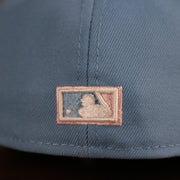 The MLB logo on the back side of the retro Philadelphia Phillies 1996 All Star Game pink underbrim fitted cap.
