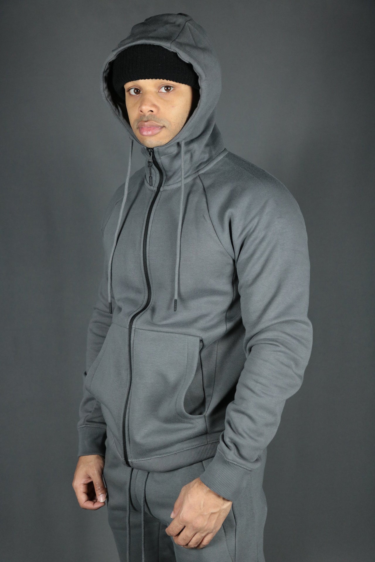 A model sporting the charcoal Jordan Craig basic fleece hoodie with Jordan Craig charcoal sweatpants.
