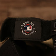 The MLB genuine merchandise tag inside the New York Yankees woodland camo Armed Forces Day 2021 hat.