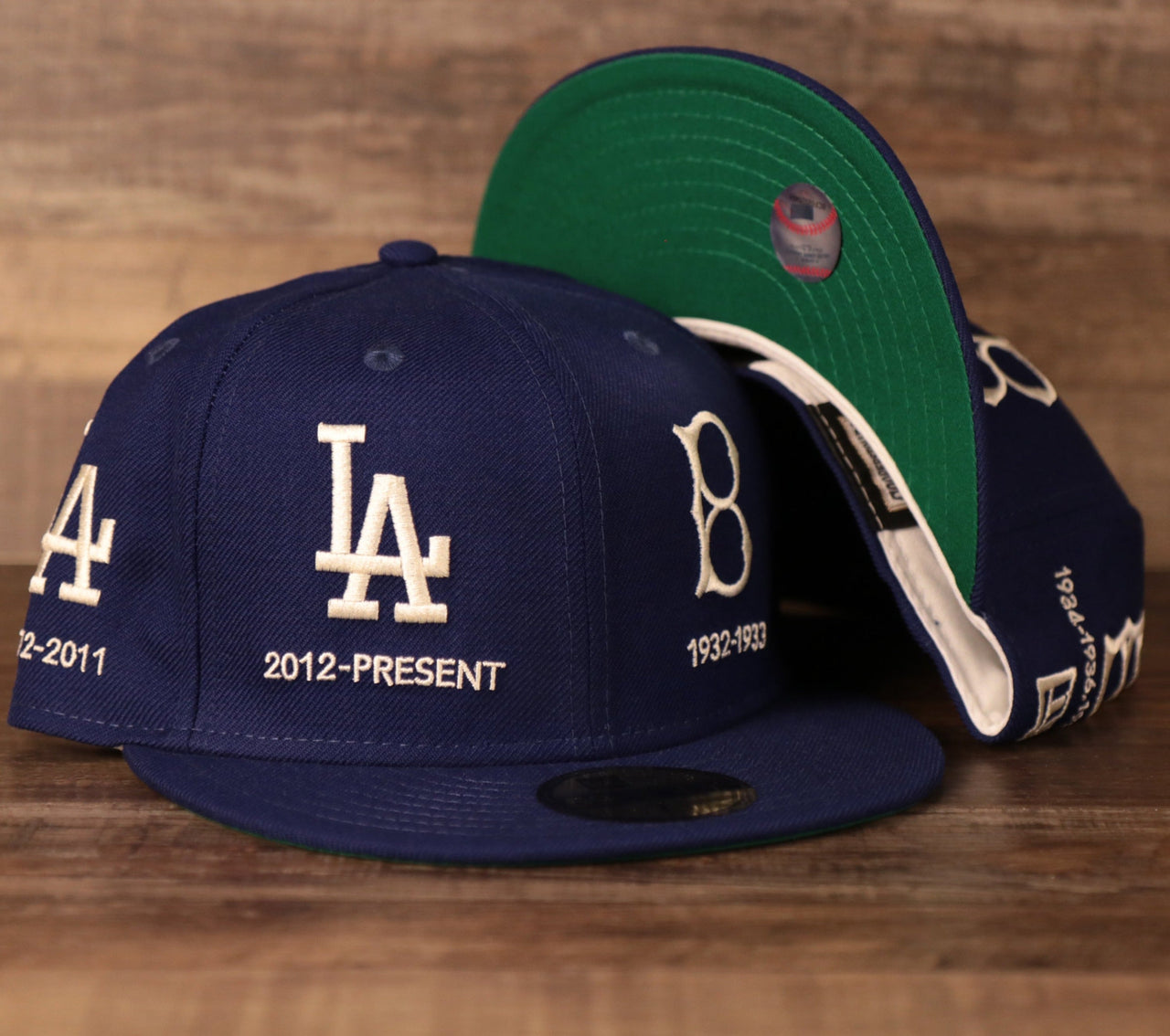 A Los Angeles Dodgers blue all-over fitted hat with green bottom brim by New Era.