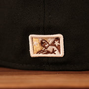 The Minor League Baseball patch on the backside of the black Philly Cheesesteak with onions fitted cap.