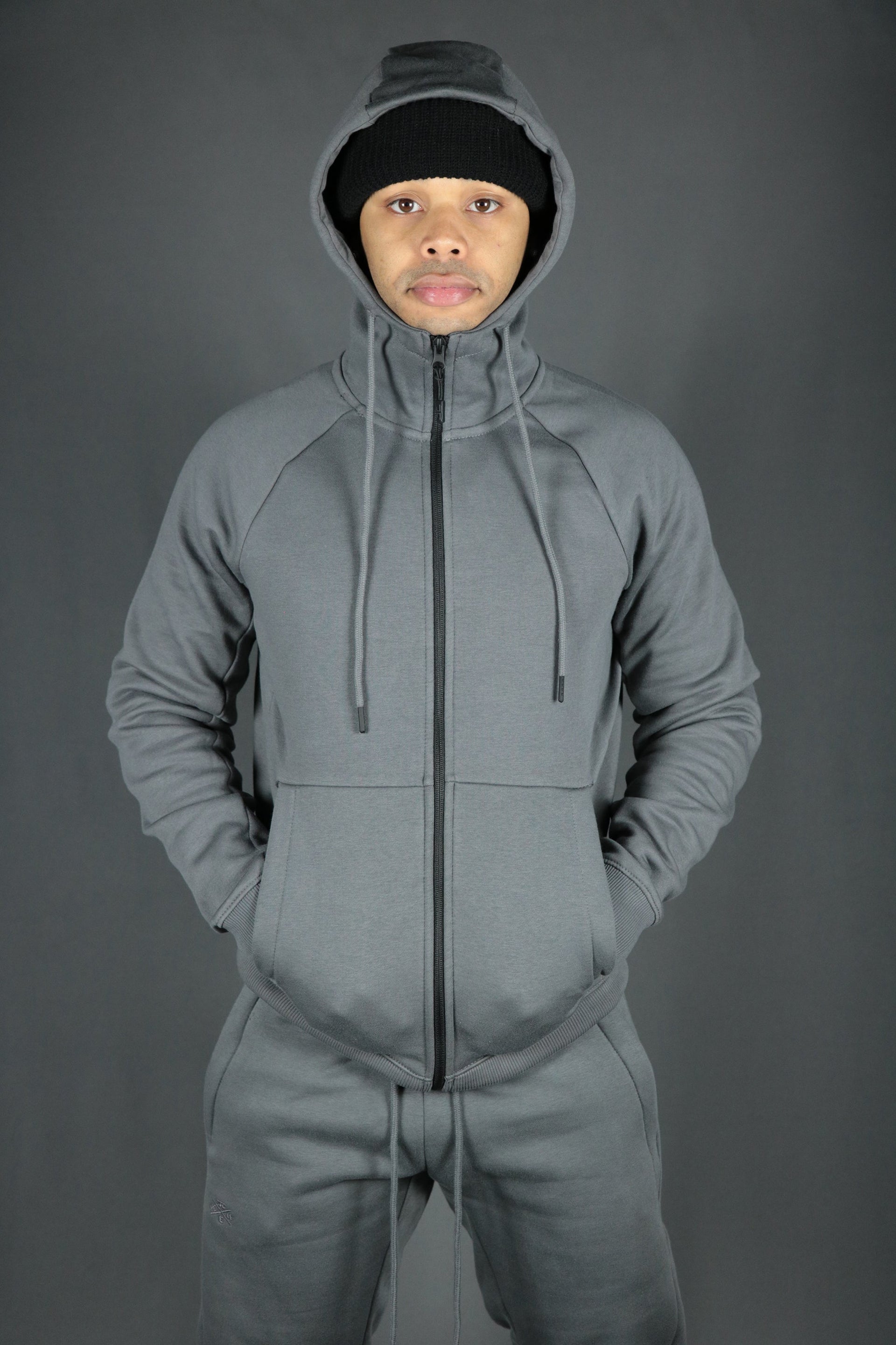 A full view of the basic tech fleece hoodie in charcoal by Jordan Craig.