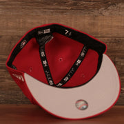 An inside look of the red Philly Cheesesteak grey bottom side patch fitted cap by New Era.