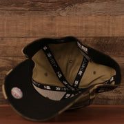 The black underbrim of the New York Yankees 2021 Memorial Day woodland camo cap by New Era.