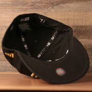 The inside of the vintage black under brim fitted cap for the Pittsburgh Pirates by New Era.