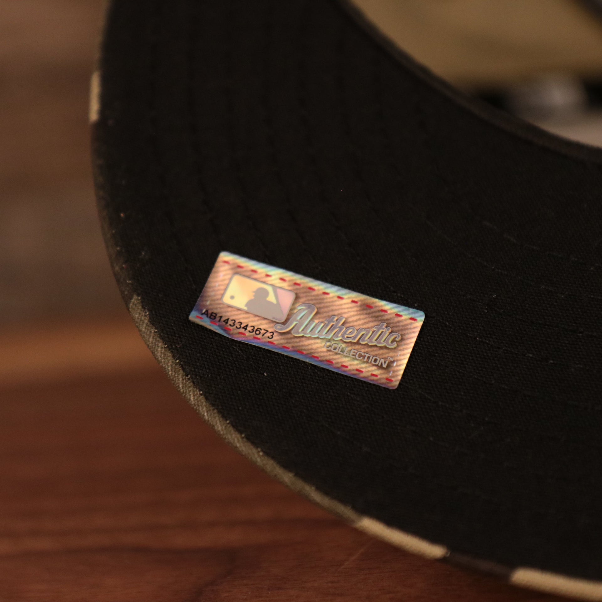 The authentic Armed Forces Day Collection tag on the 2021 Phillies camo hat.