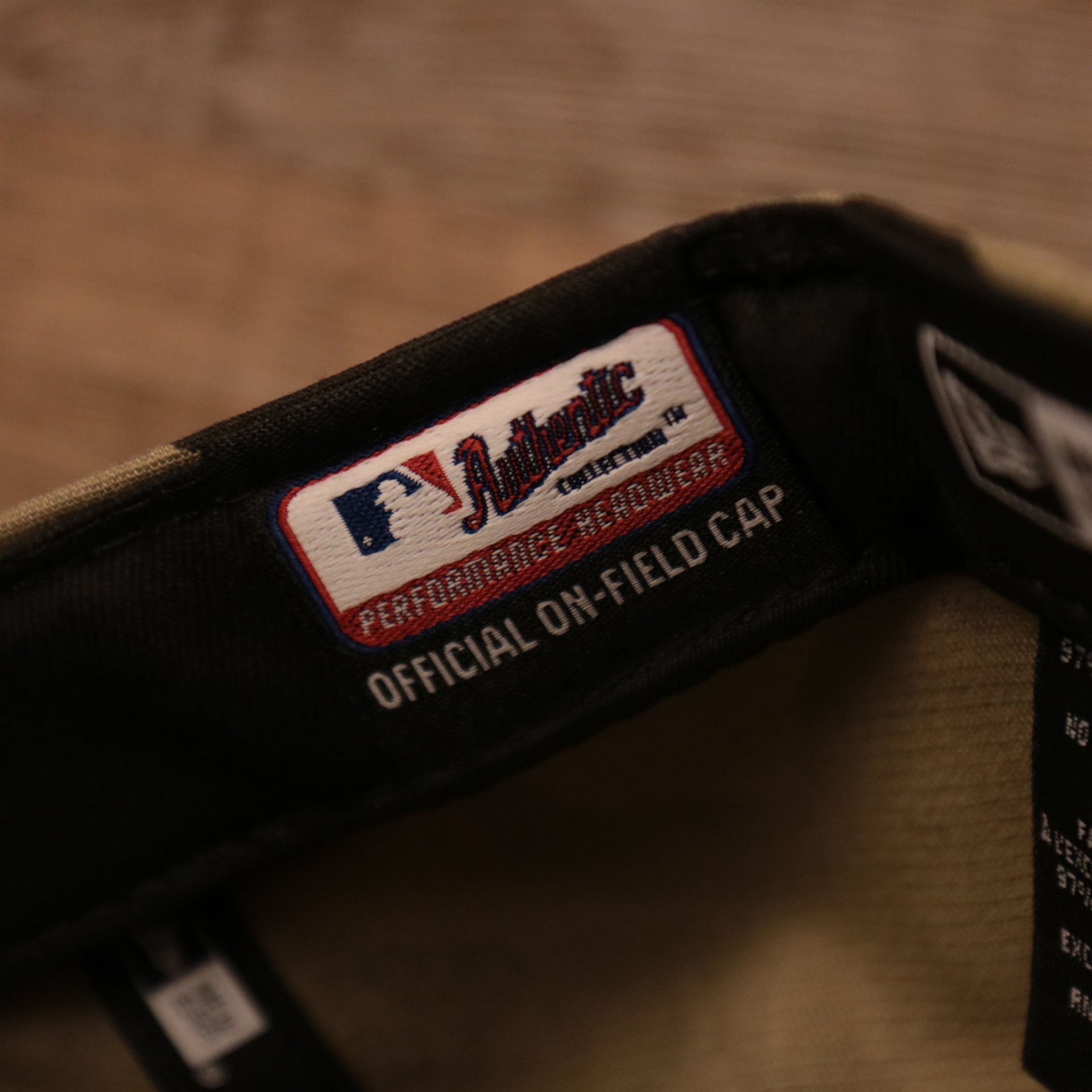The official on-field cap tag on the 2021 Philadelphia Phillies camo hat by New Era.