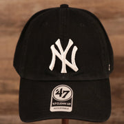 The cotton black New York Yankees pink bottom dad hat by 47 Brand.
