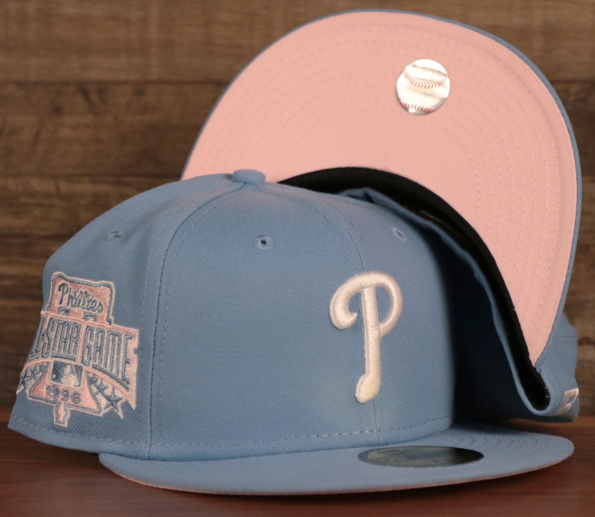 The MLB 1996 All Star Game ice blue side patch pink bottom fitted hat for the Philadelphia Phillies by New Era.