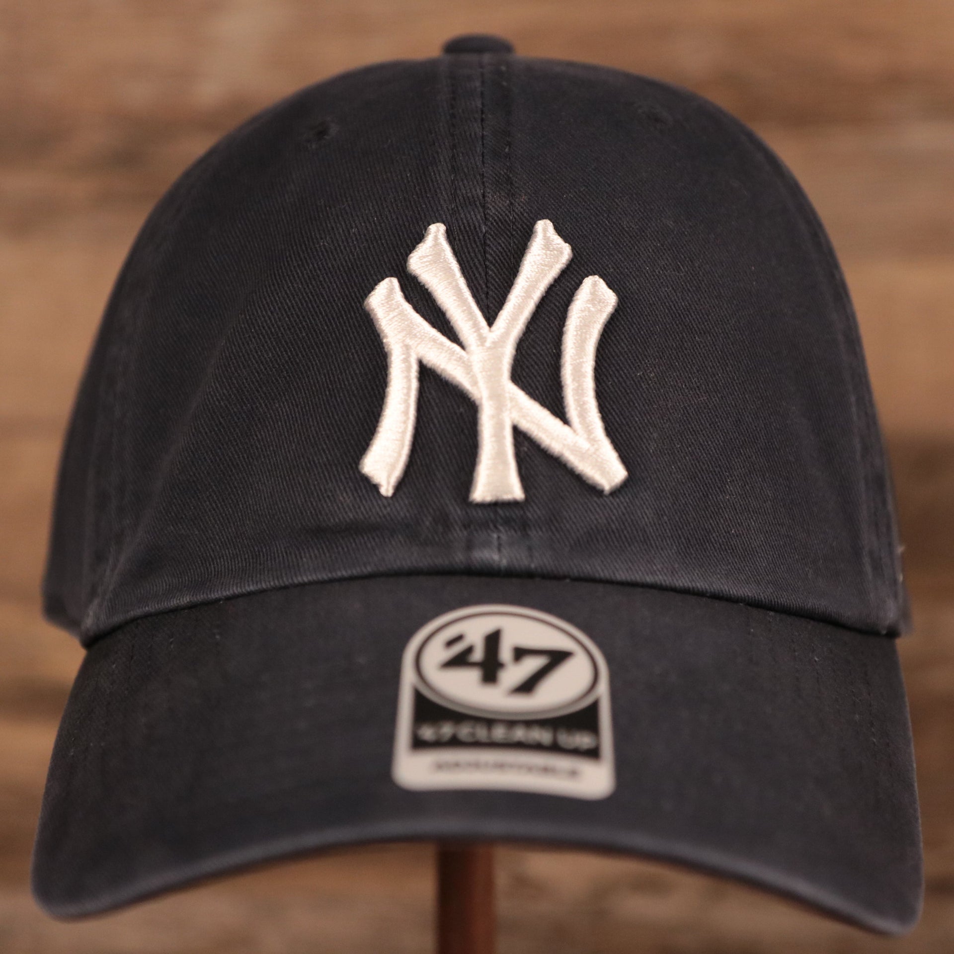 The cotton navy blue New York Yankees pink bottom dad hat by 47 Brand.