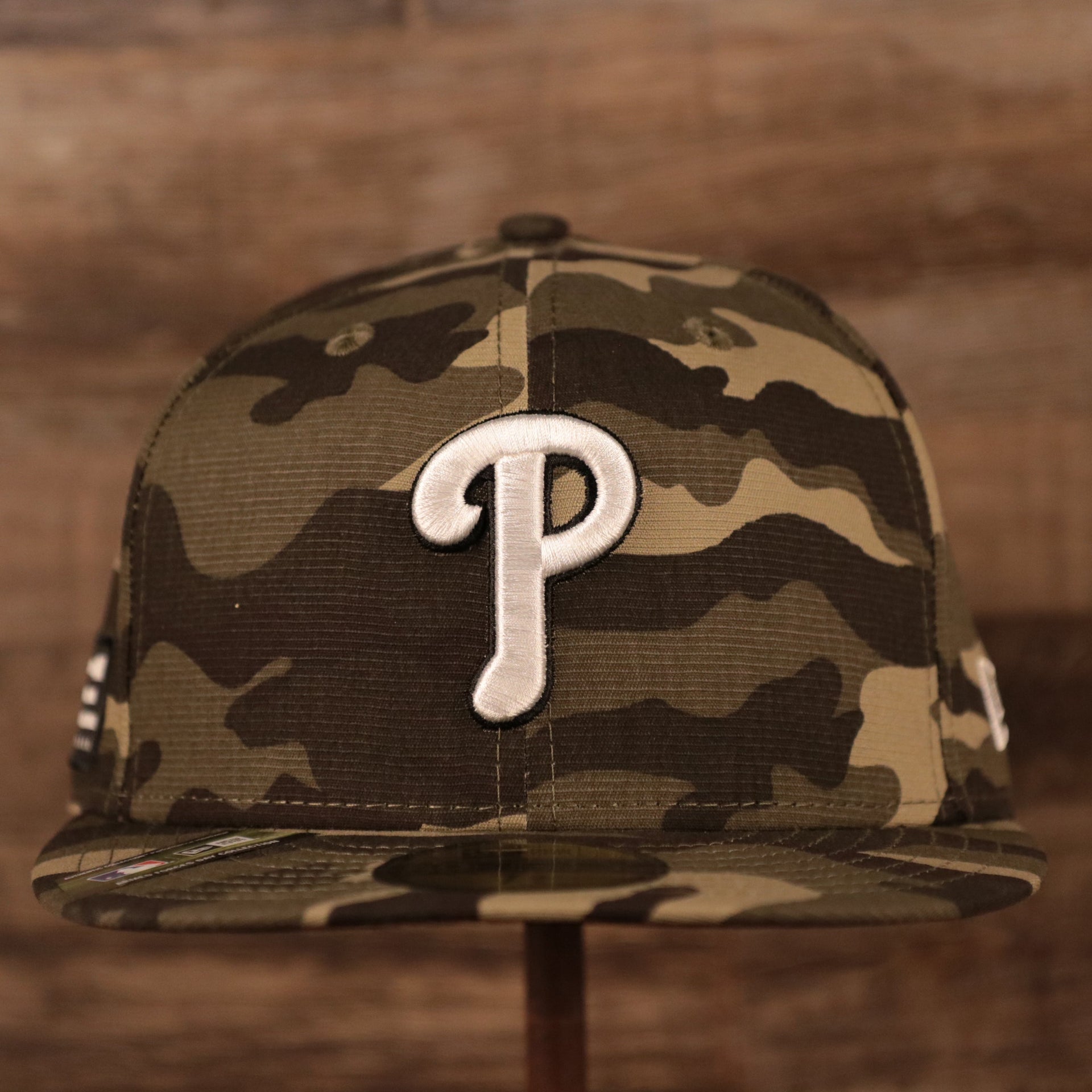 The Philadelphia Phillies logo on the front of the on-field Armed Forces Day 2021 59fifty fitted hat by New Era.